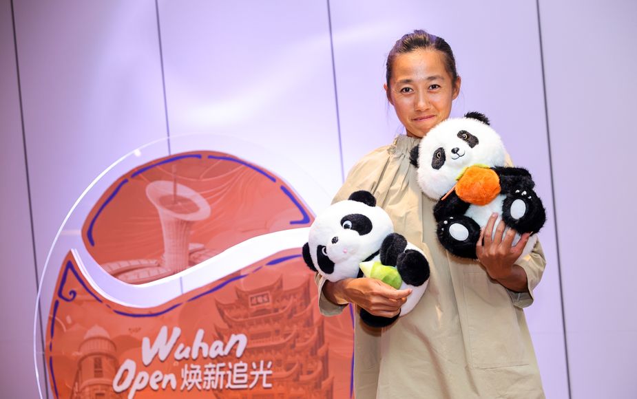 Zhang Shuai, fresh off a quarterfinal effort in Beijing, attended the party with some fluffy friends.