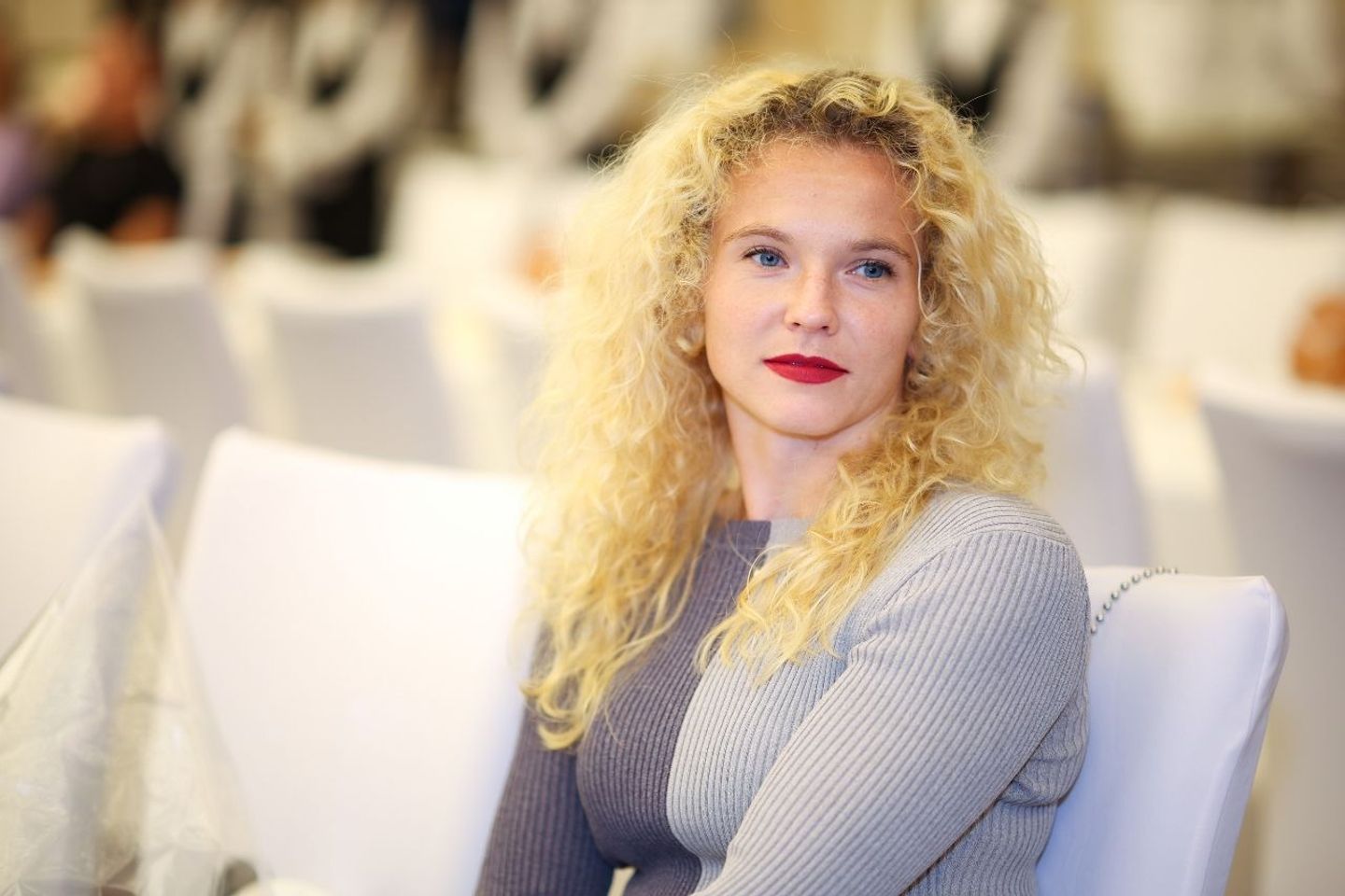 Sitting up and standing out: Katerina Siniakova opted for some striking red lipstick to add to her party look.