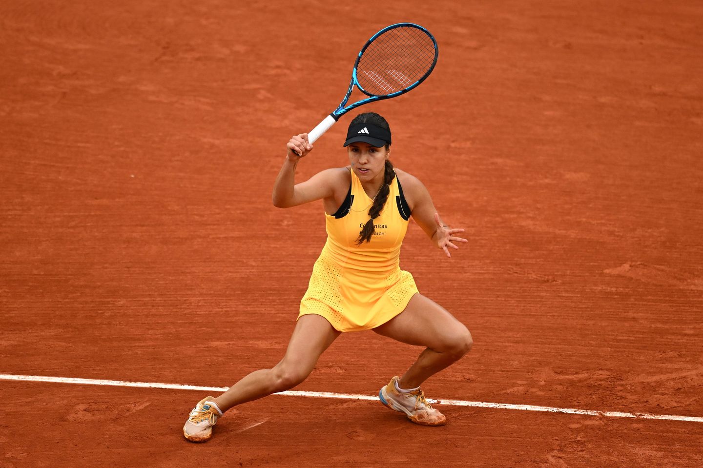 Camila Osorio saved triple match point as Anhelina Kalinina served at 6-5 in the second set of their Roland Garros first round, ultimately advancing when Kalinina retired due to injury trailing 3-6, 7-6(2), 4-1.